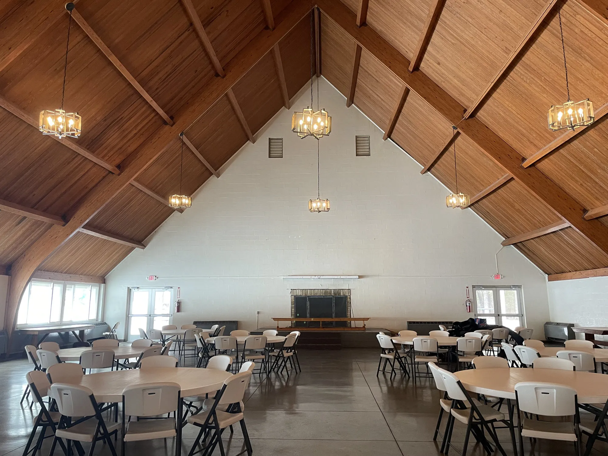 Large open ski lodge room with fireplace